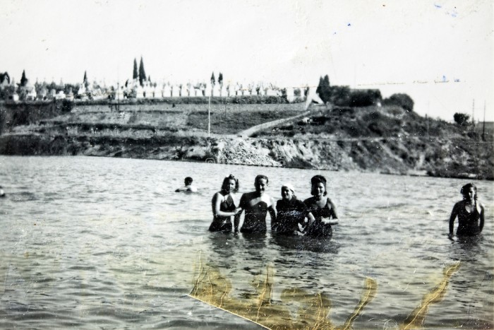 group standing in the water summer vacationing 1940s 1950s